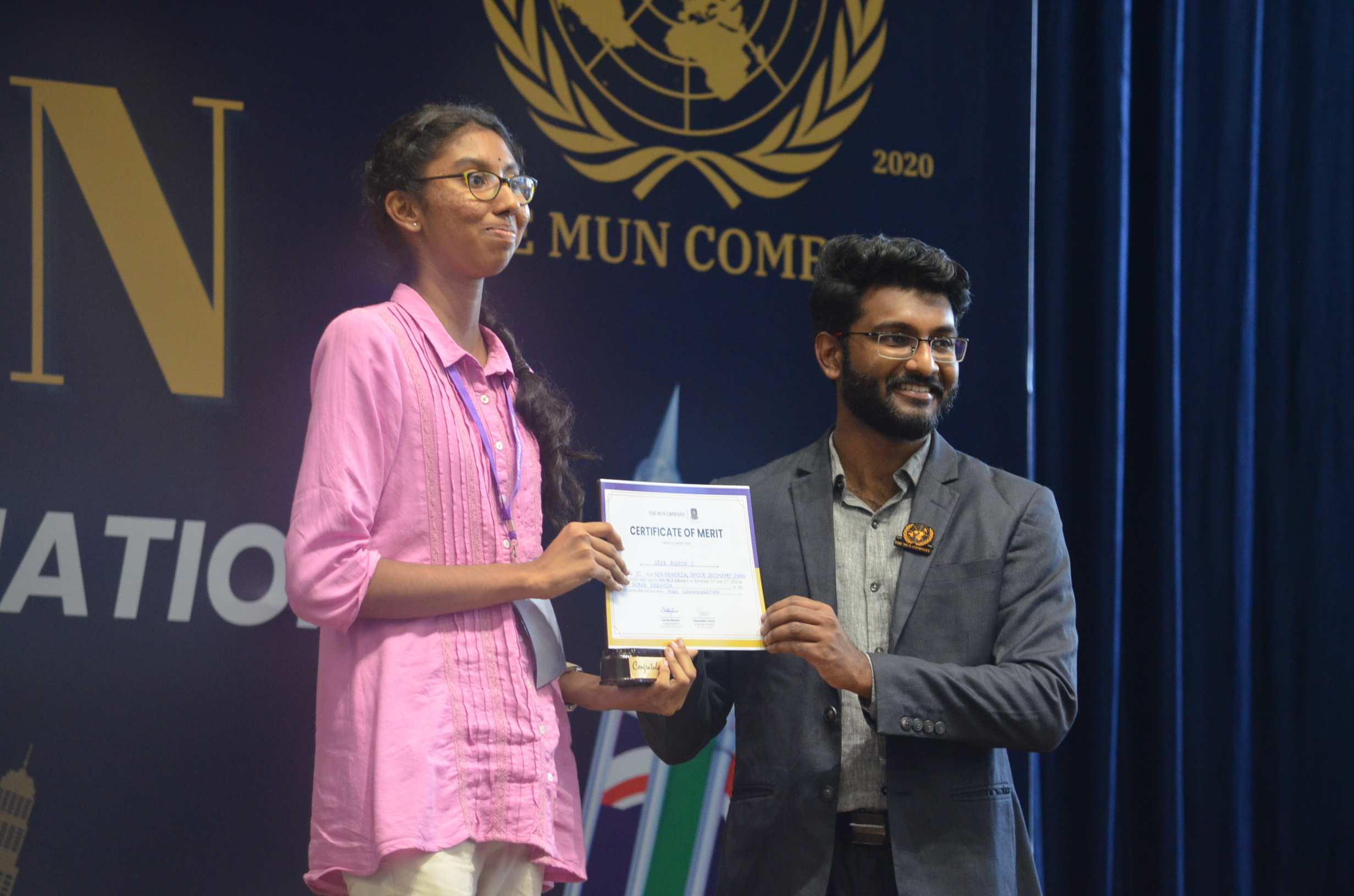 Student receiving public speaking certificate